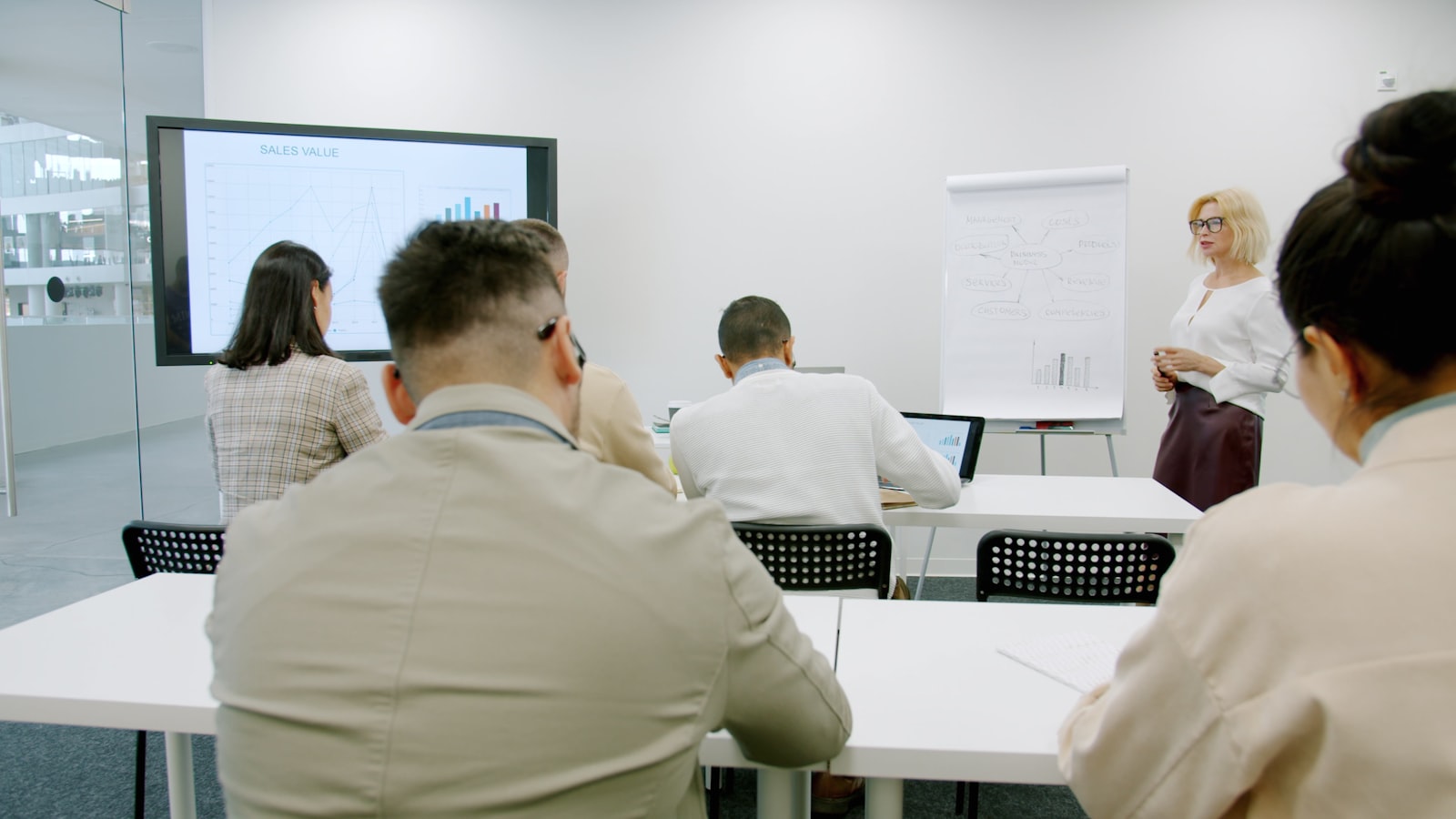 Professionals attending a structured training presentation